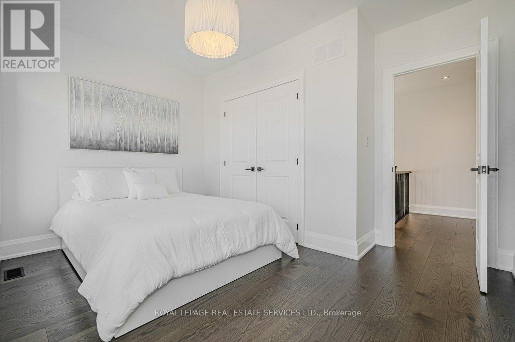 Fourth Bedroom with Wide Plank Hardwood Flooring