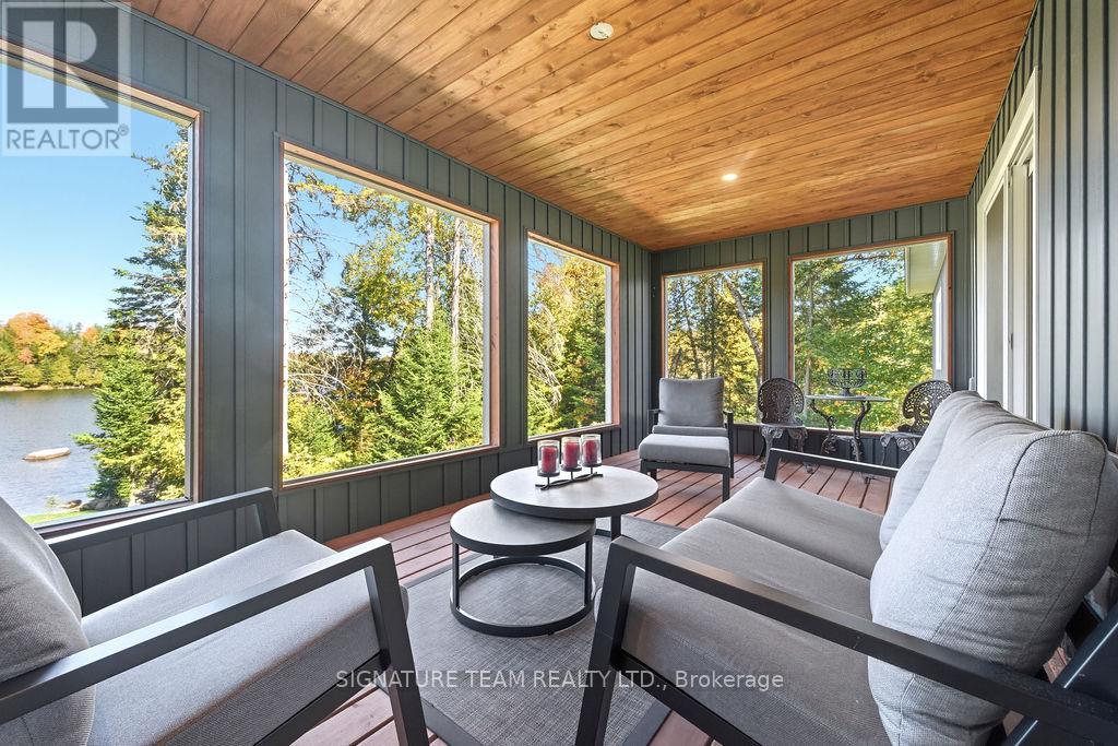 Enclosed Deck Overlooking the Lake