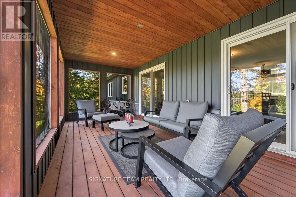 Enclosed Deck Overlooking the Lake