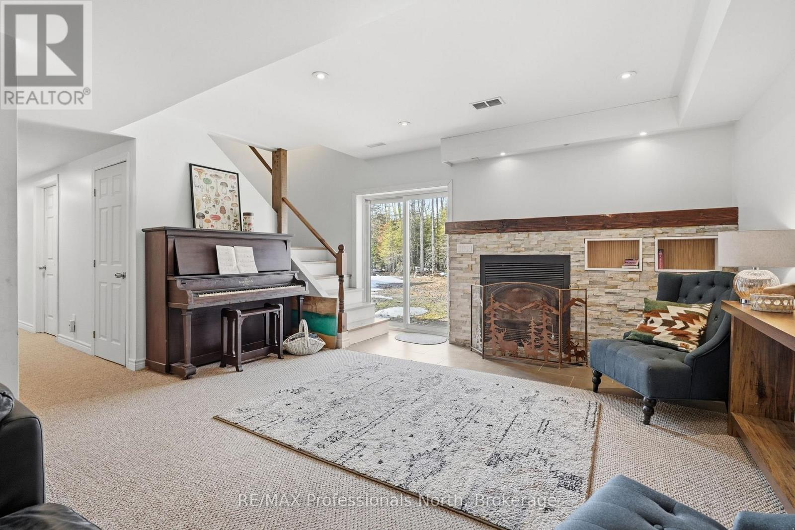 Lower level walkout with wood burning stove.
