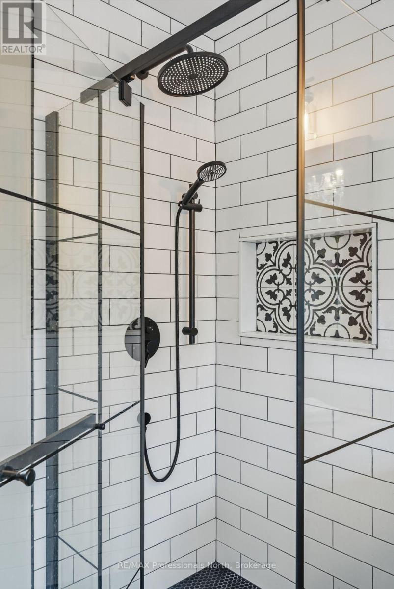 Custom glass and tire shower w/ shower niche.
