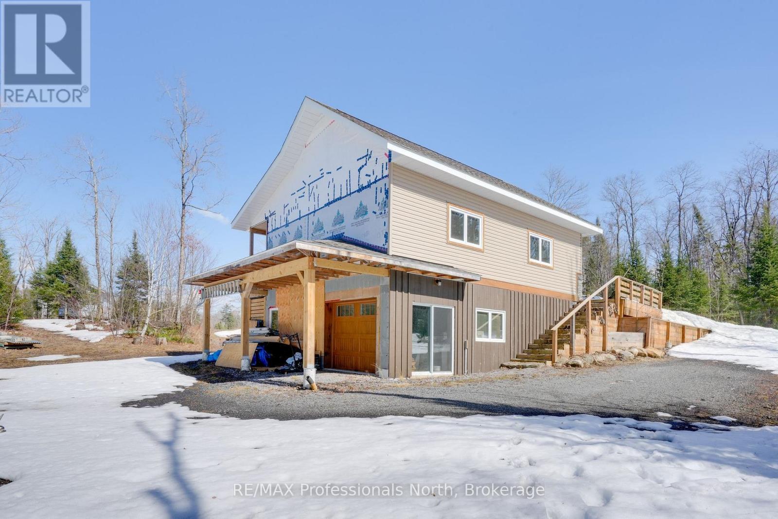 Lower level shop of detached garage.