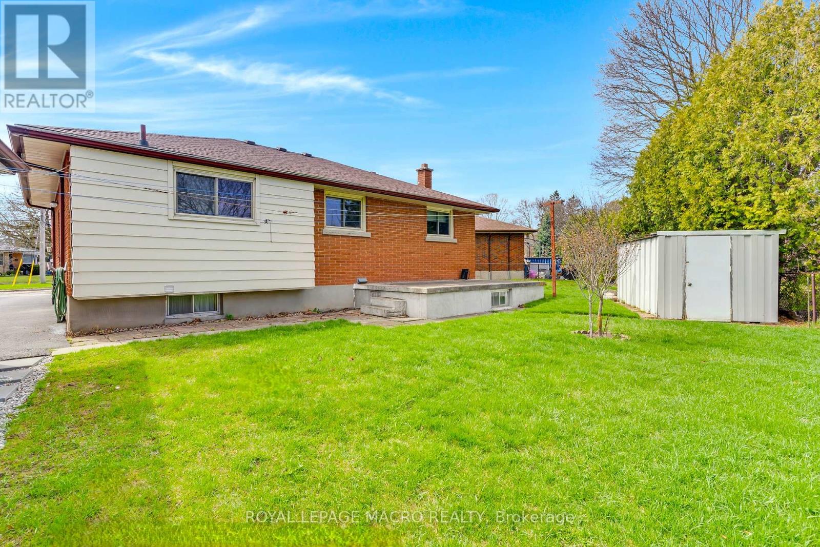 Backyard with shed, and concrete patio