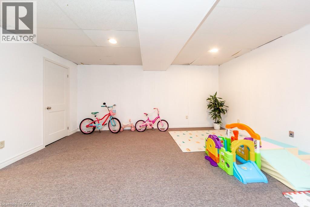 Game room with carpet floors, a drop ceiling, and recessed lighting