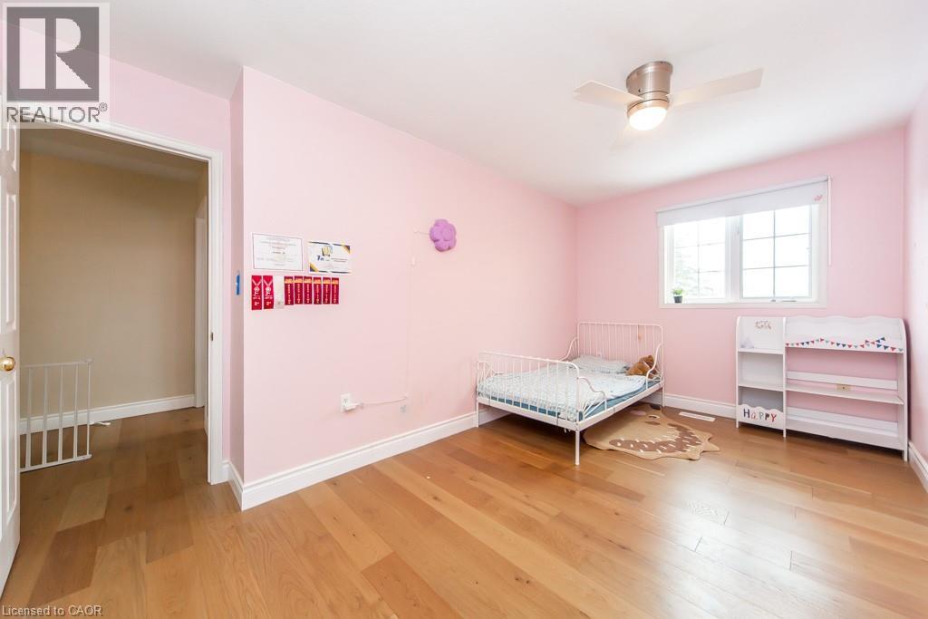 Bedroom with light wood-style flooring and ceiling fan