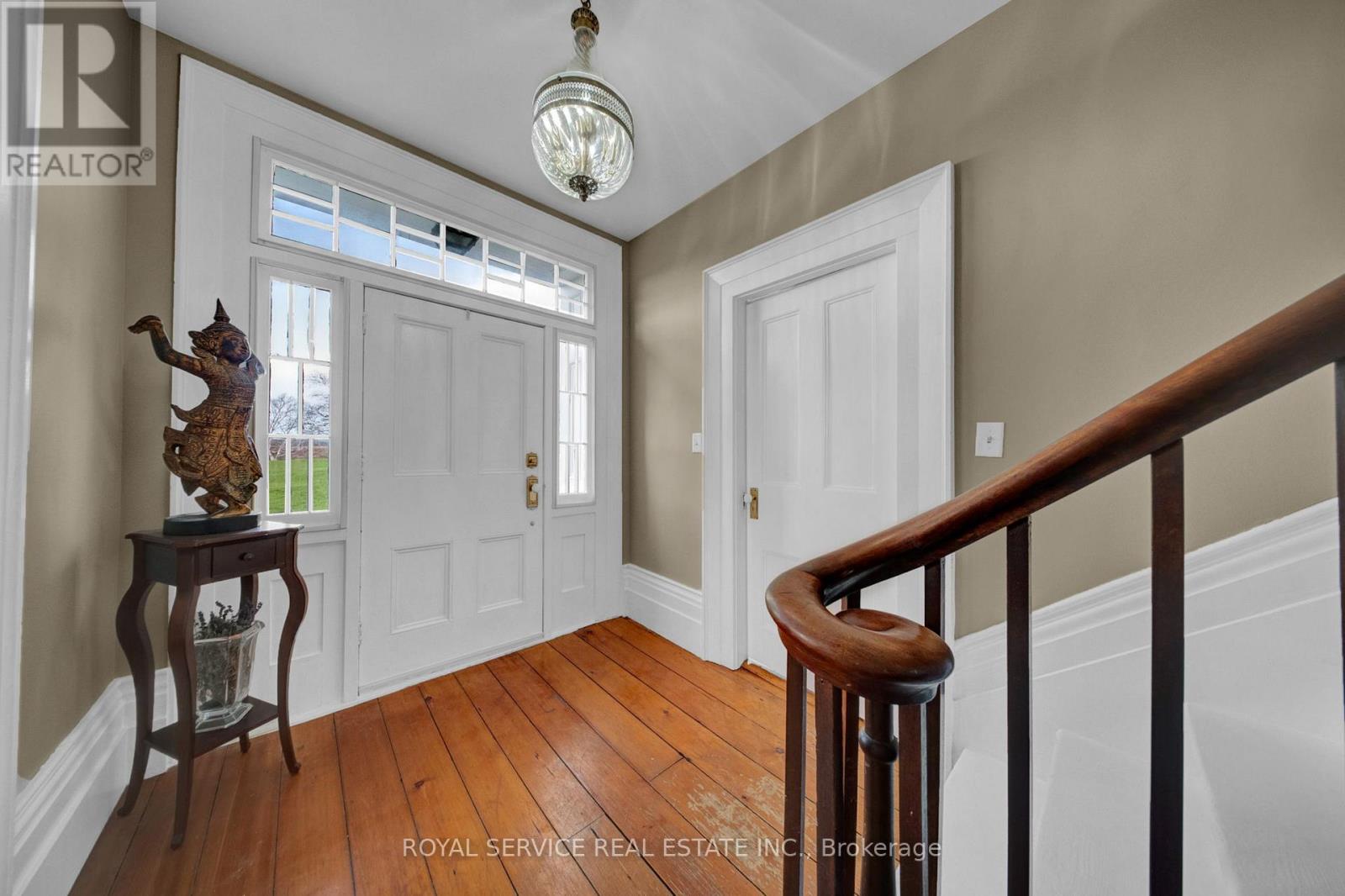 Front Foyer Original Wood Plank Floors & Bannister