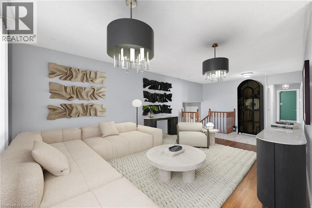 Living area with suspended lighting and light wood-type flooring