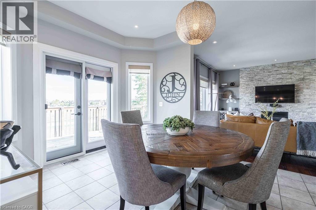 Sunlight bathes the space in warmth. Garden doors lead to elevated deck