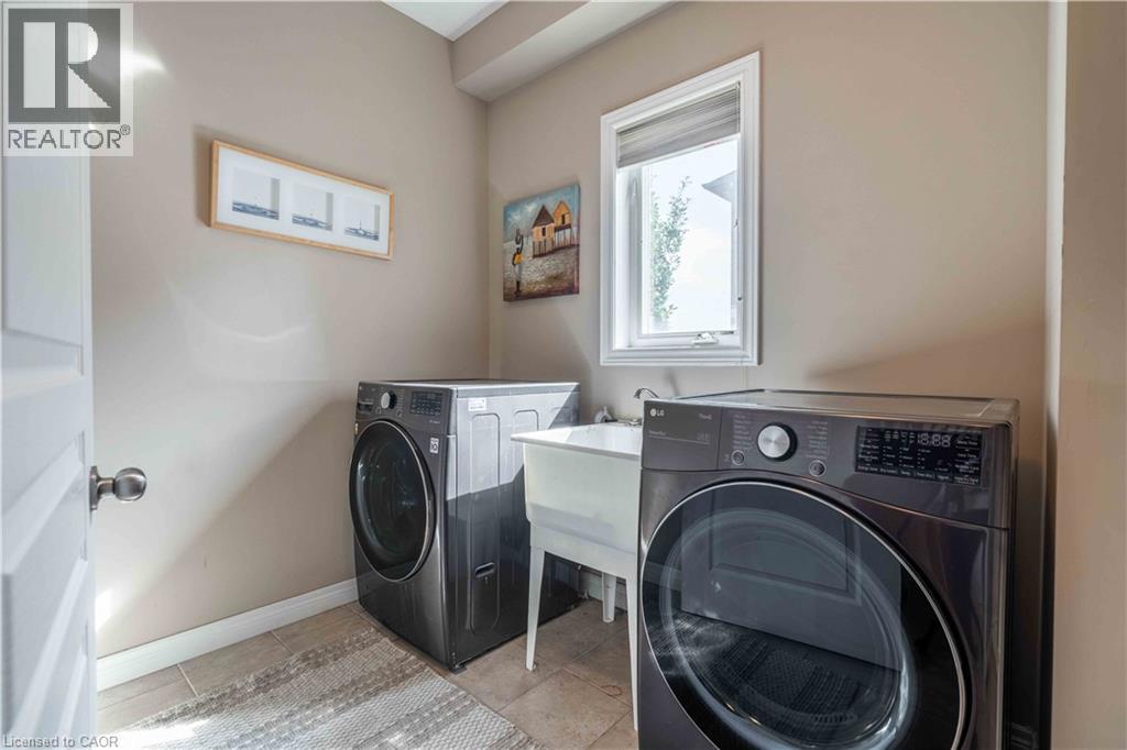 Main level laundry serves as mudroom with direct access to garage.