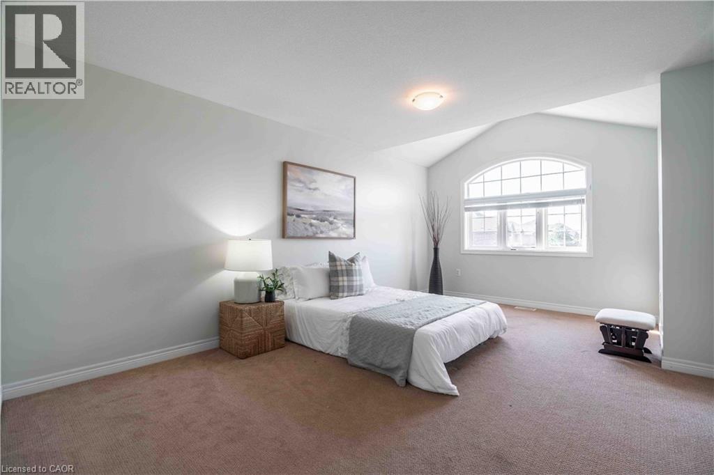 Soaring ceiling with huge window create a welcoming bedroom.