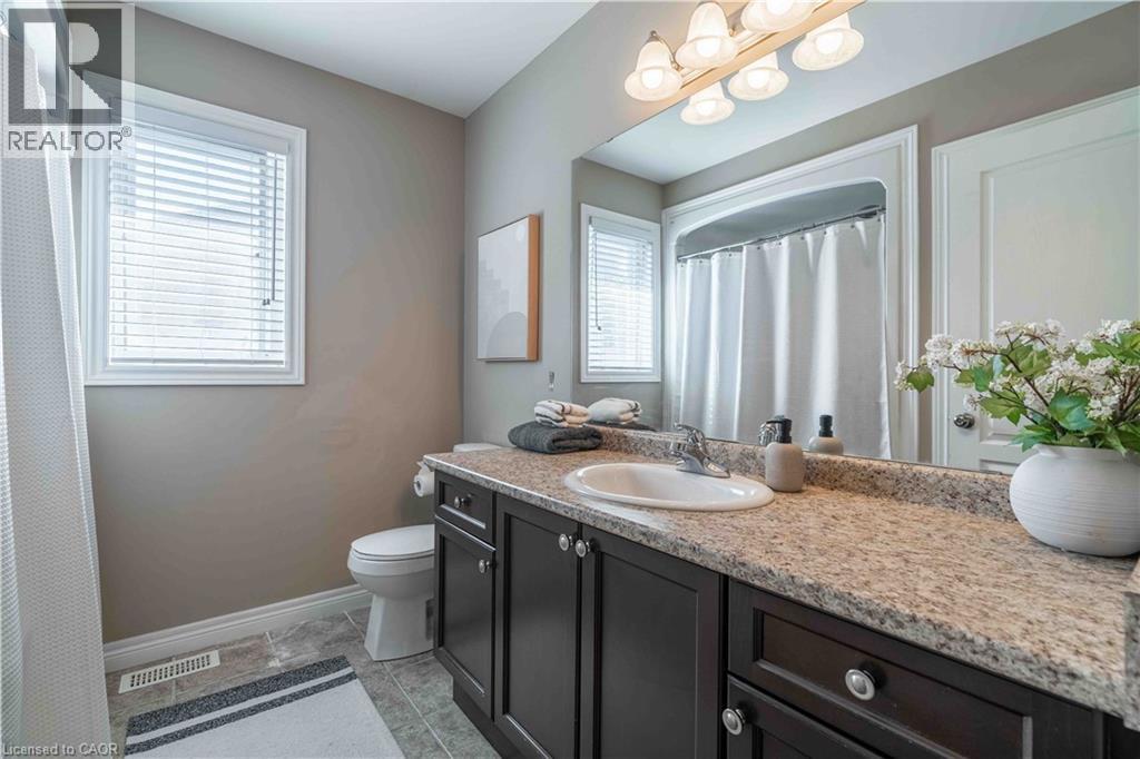 B4 pc bathroom with vanity and light tile patterned flooring