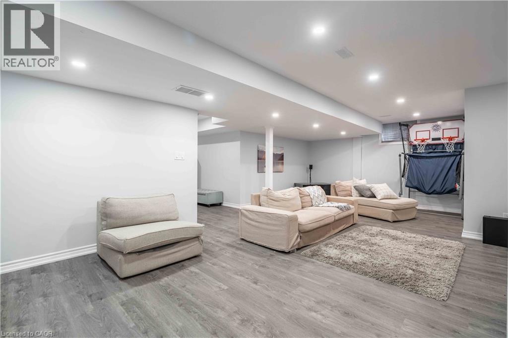 recessed lighting and wood finished floors