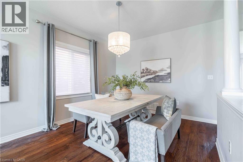 Columns, half wall and large window plus engineered hardwood floors add to the ambiance of this space