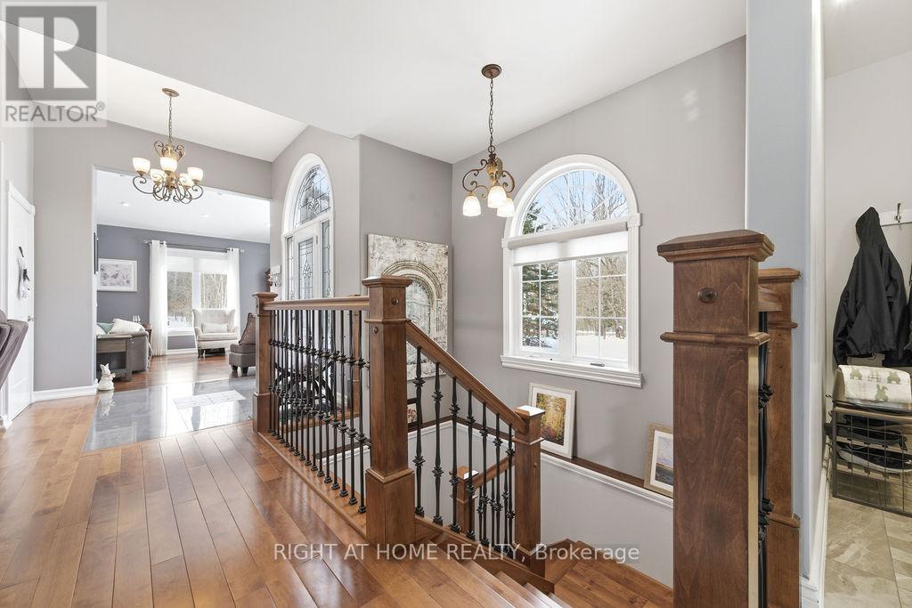 Elegant Updated Banister and Hardwood Stairs
