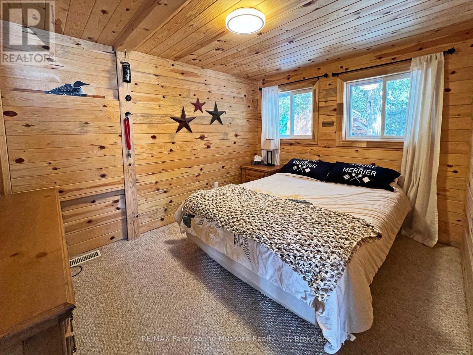 Warm cozy pine enhanced bedroom