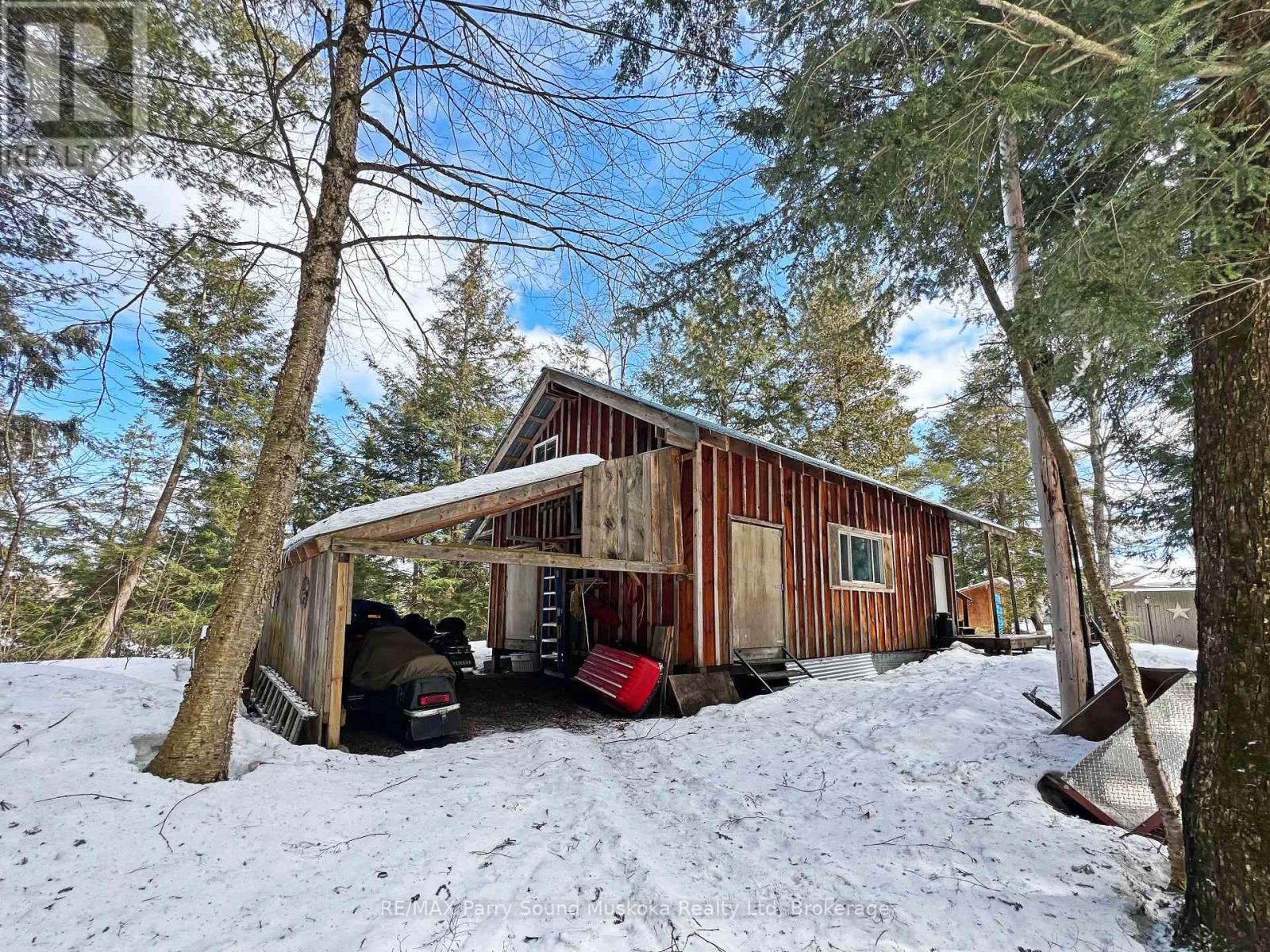 Detached shop w carport for the boats, atv, sled
