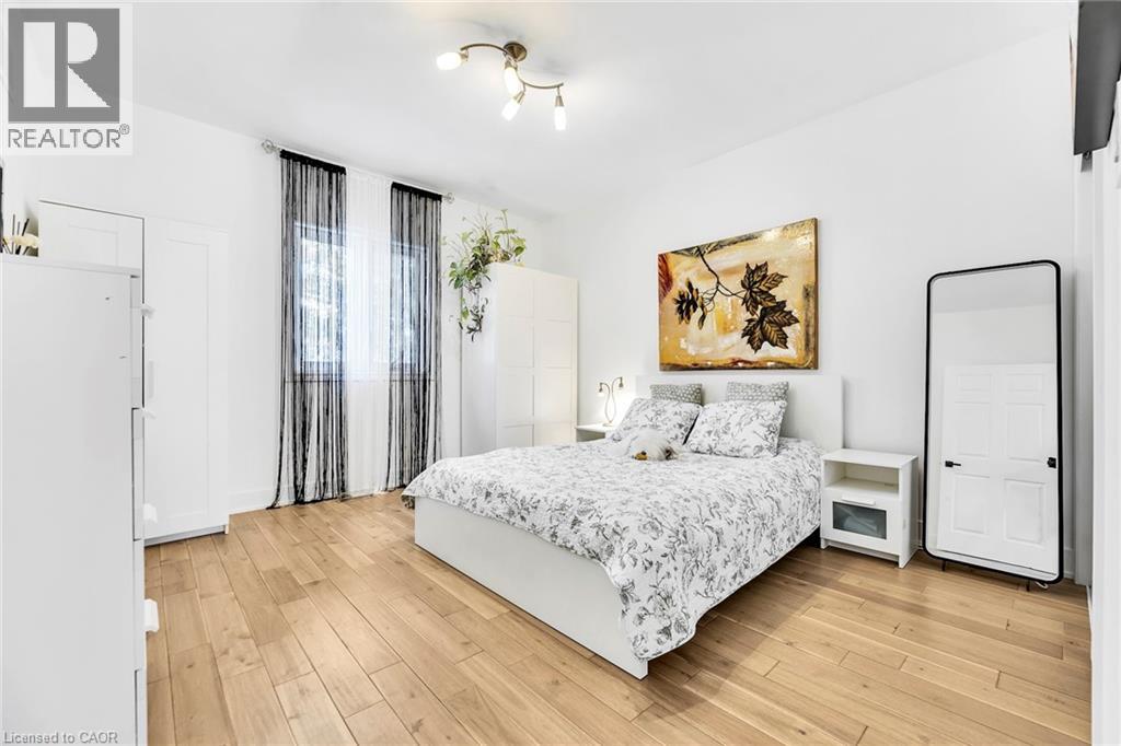 Bright room featuring wood-finish flooring and white walls