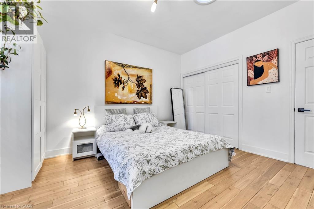 Light wood-finish flooring complements white walls