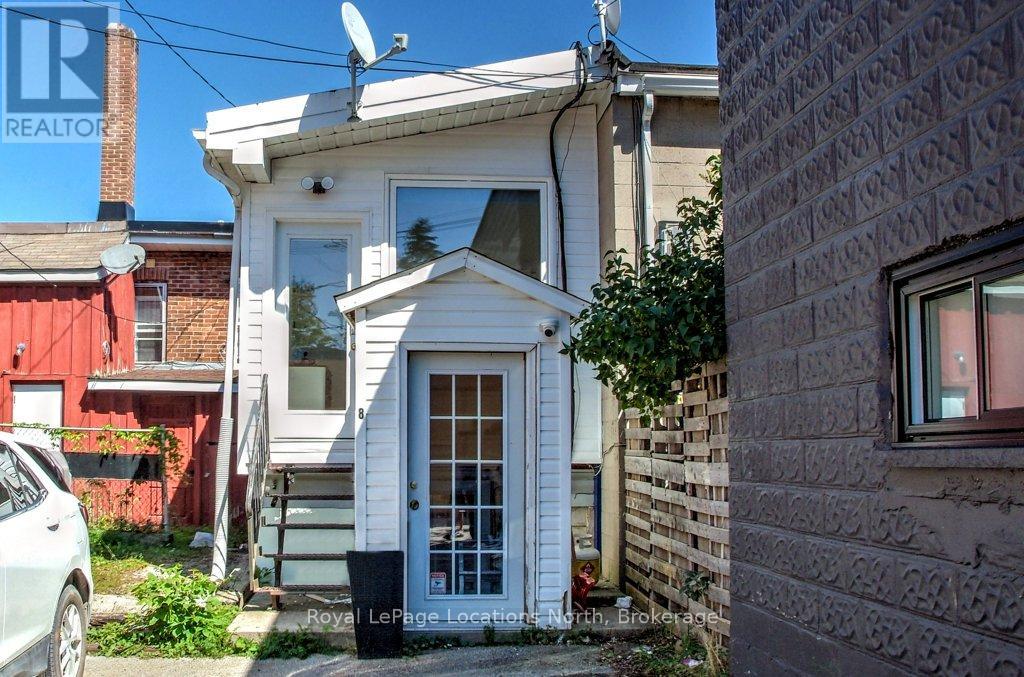 Back entrances to apartment and commercial unit