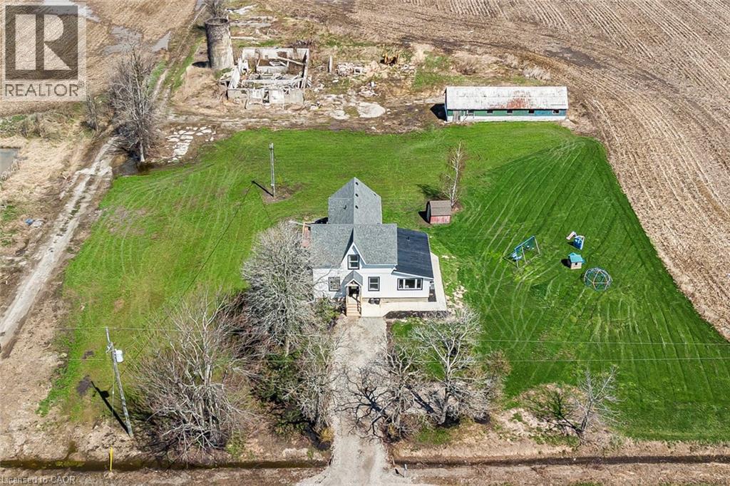 Aerial perspective showcasing a property surrounded by agricultural fields