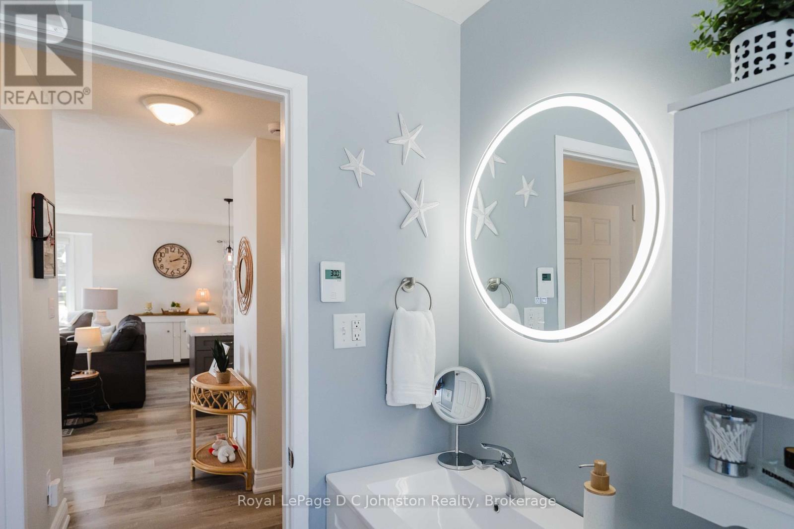 Heated Floors, Newer toilet, Vanity + Lighting