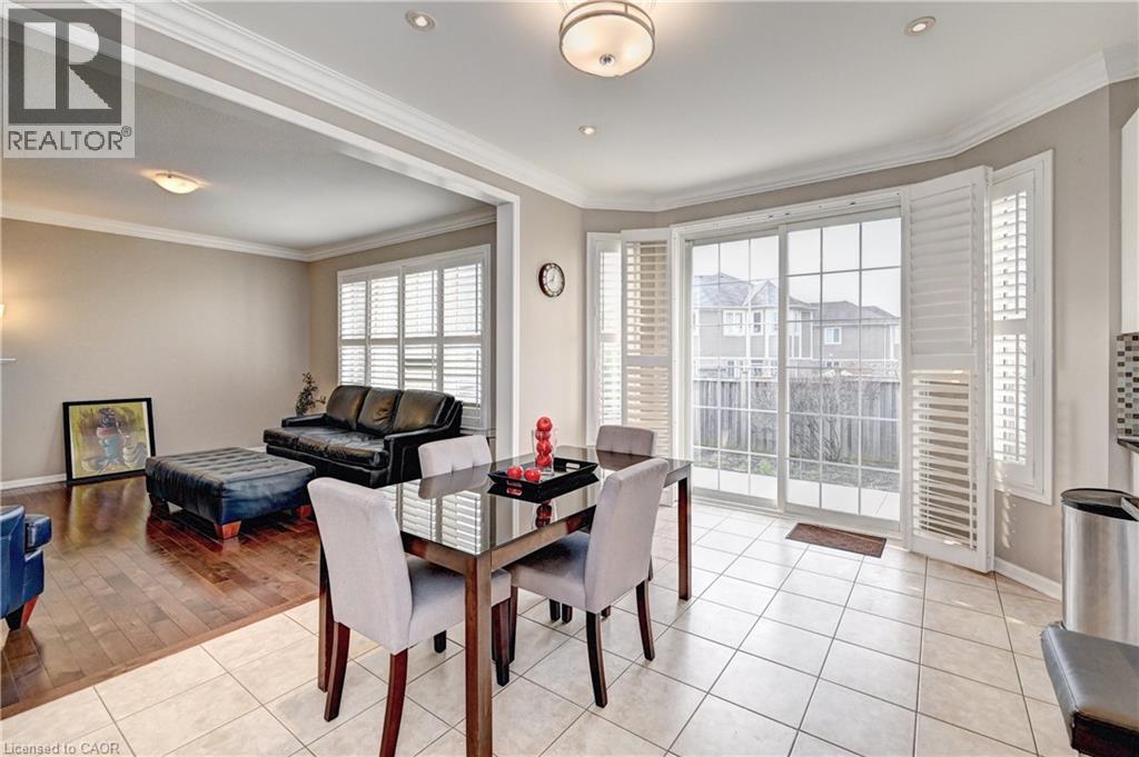 Dining area with ceramic tile flooring and a sliding glass door leading to the exterior