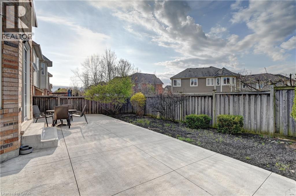 Expansive concrete patio offering ample outdoor space