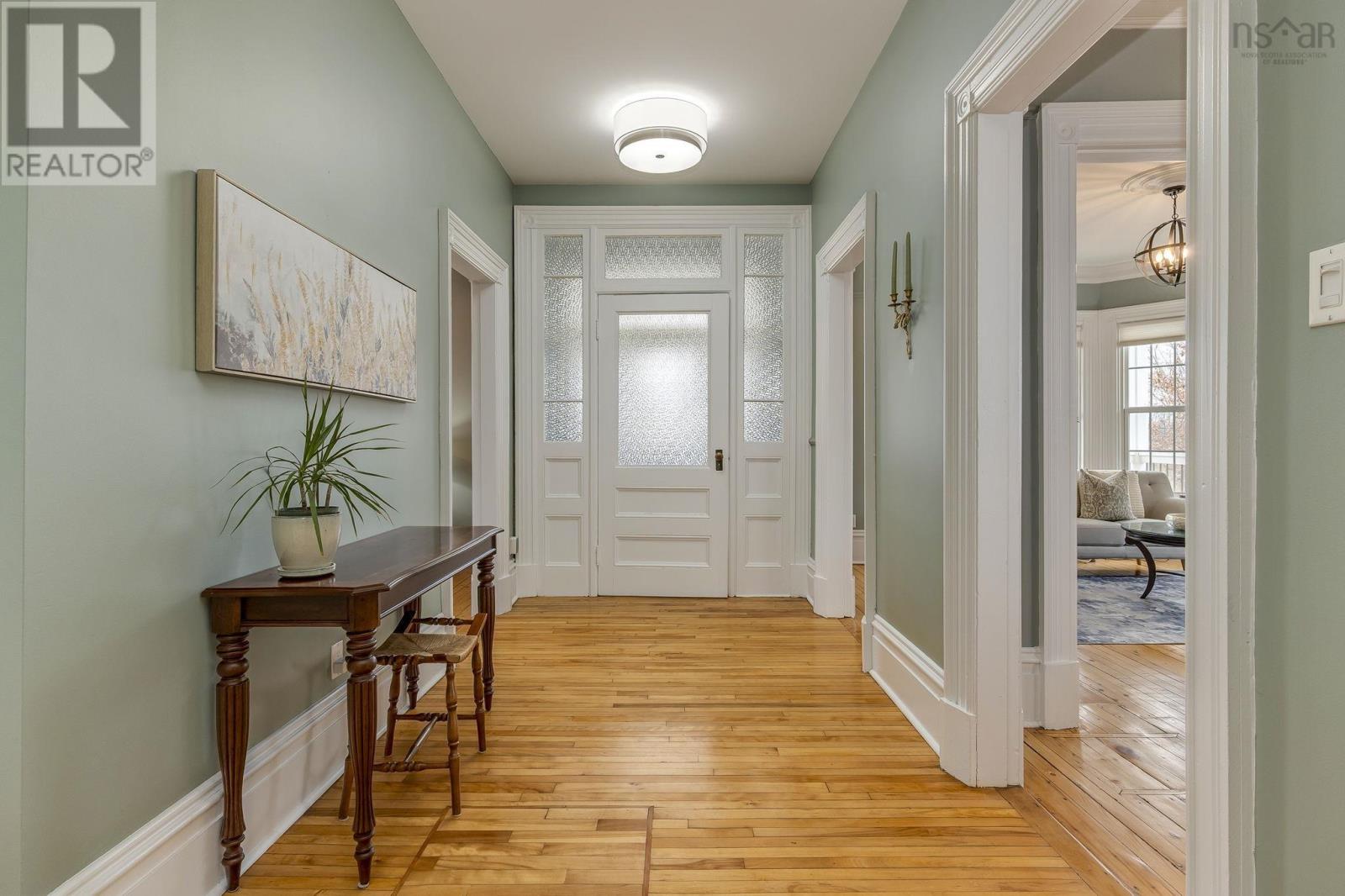 Large entry with gorgeous hardwood floors and high ceilings