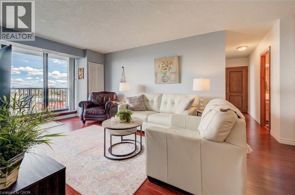 Living area featuring wood finished floors and a textured ceiling