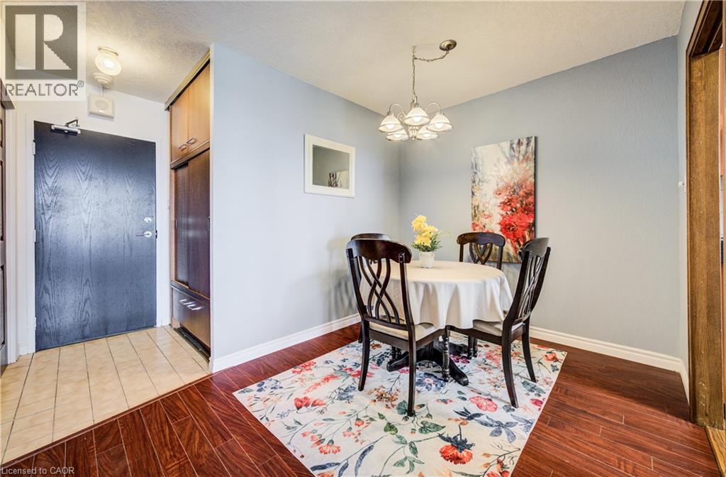 Dining area with light wood-style flooring and a chandelier