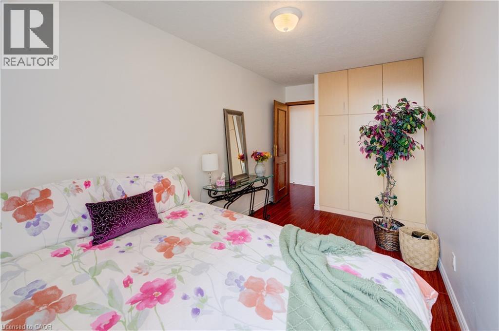 Bedroom with dark wood finished floors