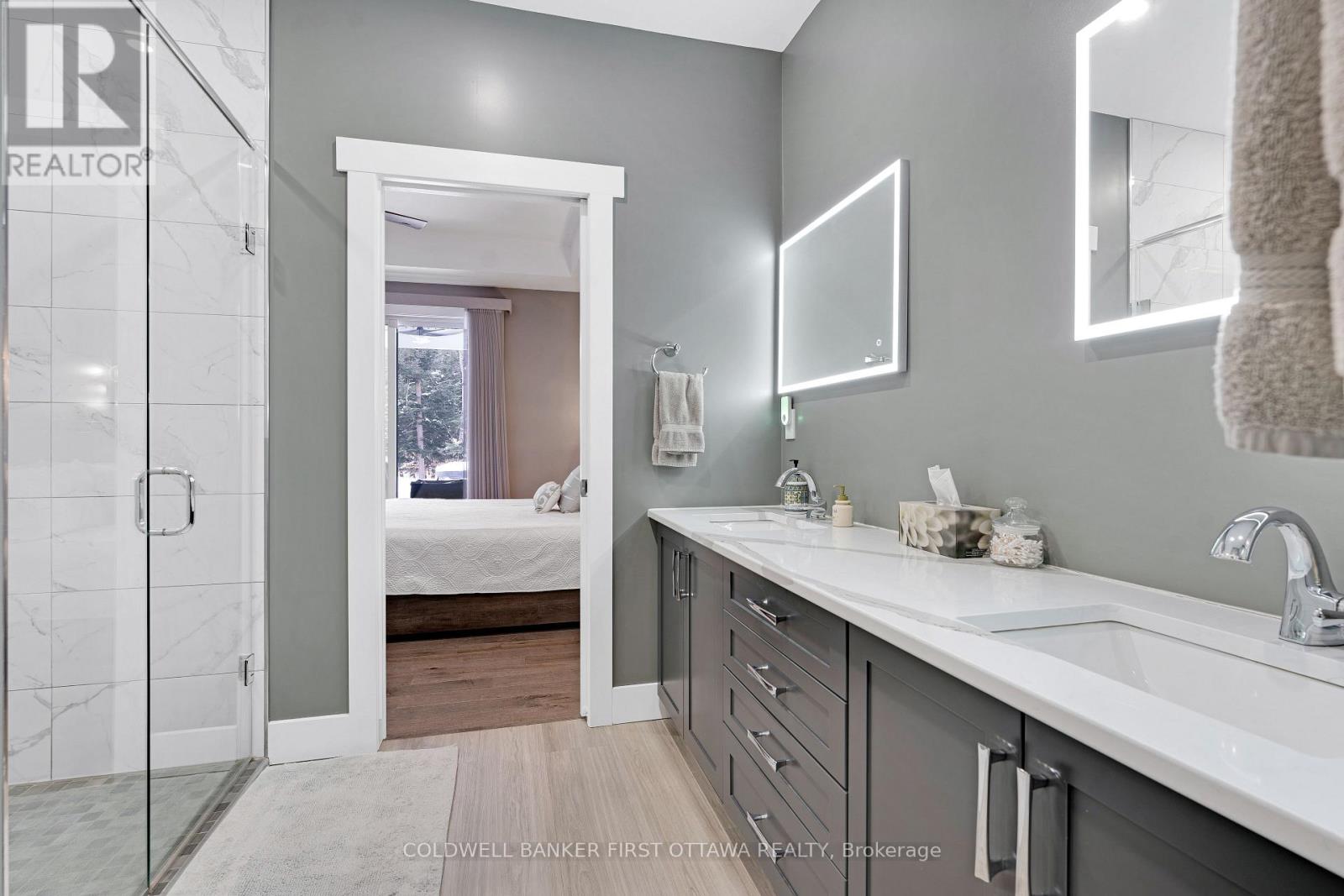 Ensuite 2-sink quartz vanity; touch-light mirrors