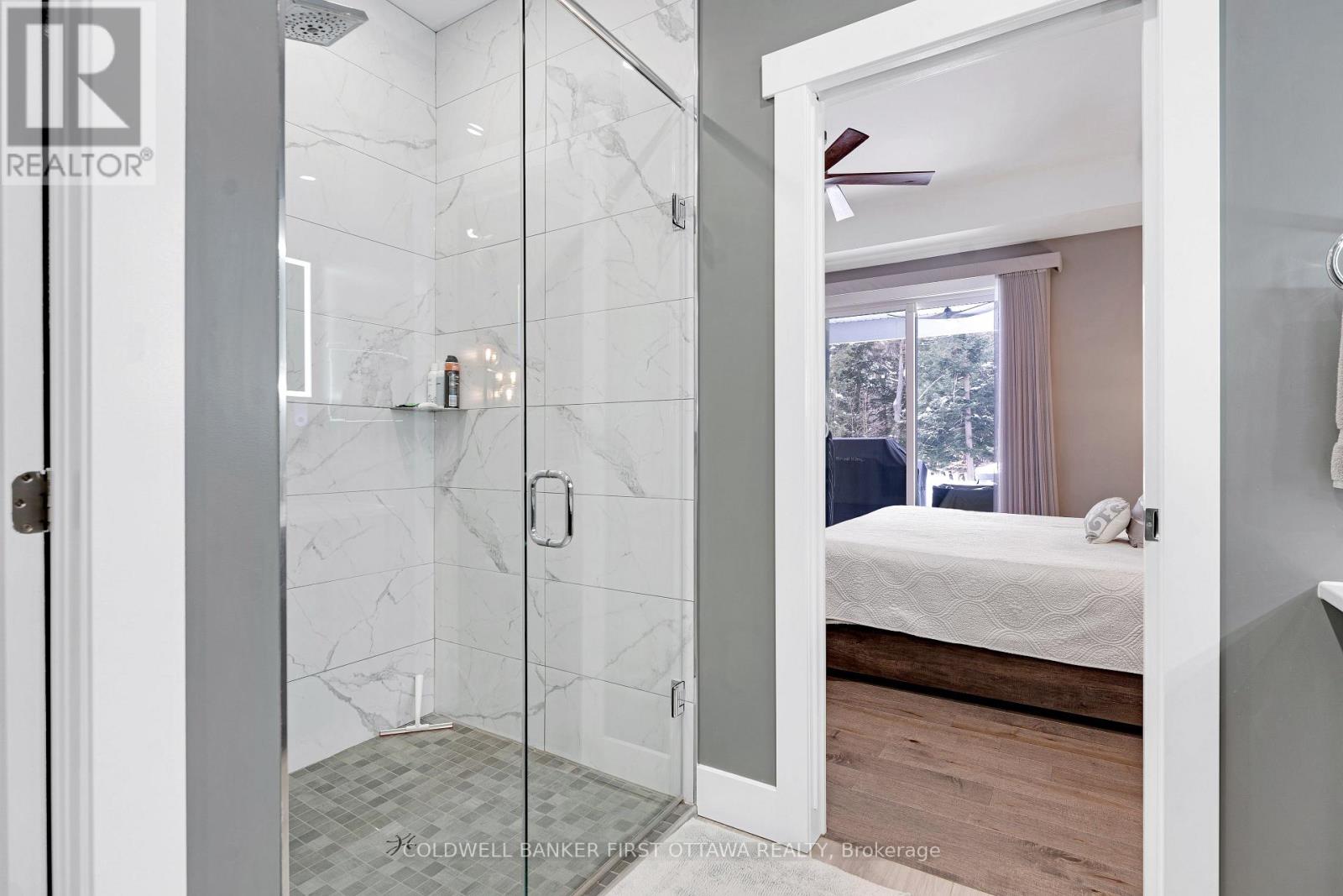 Ensuite glass shower with rain head