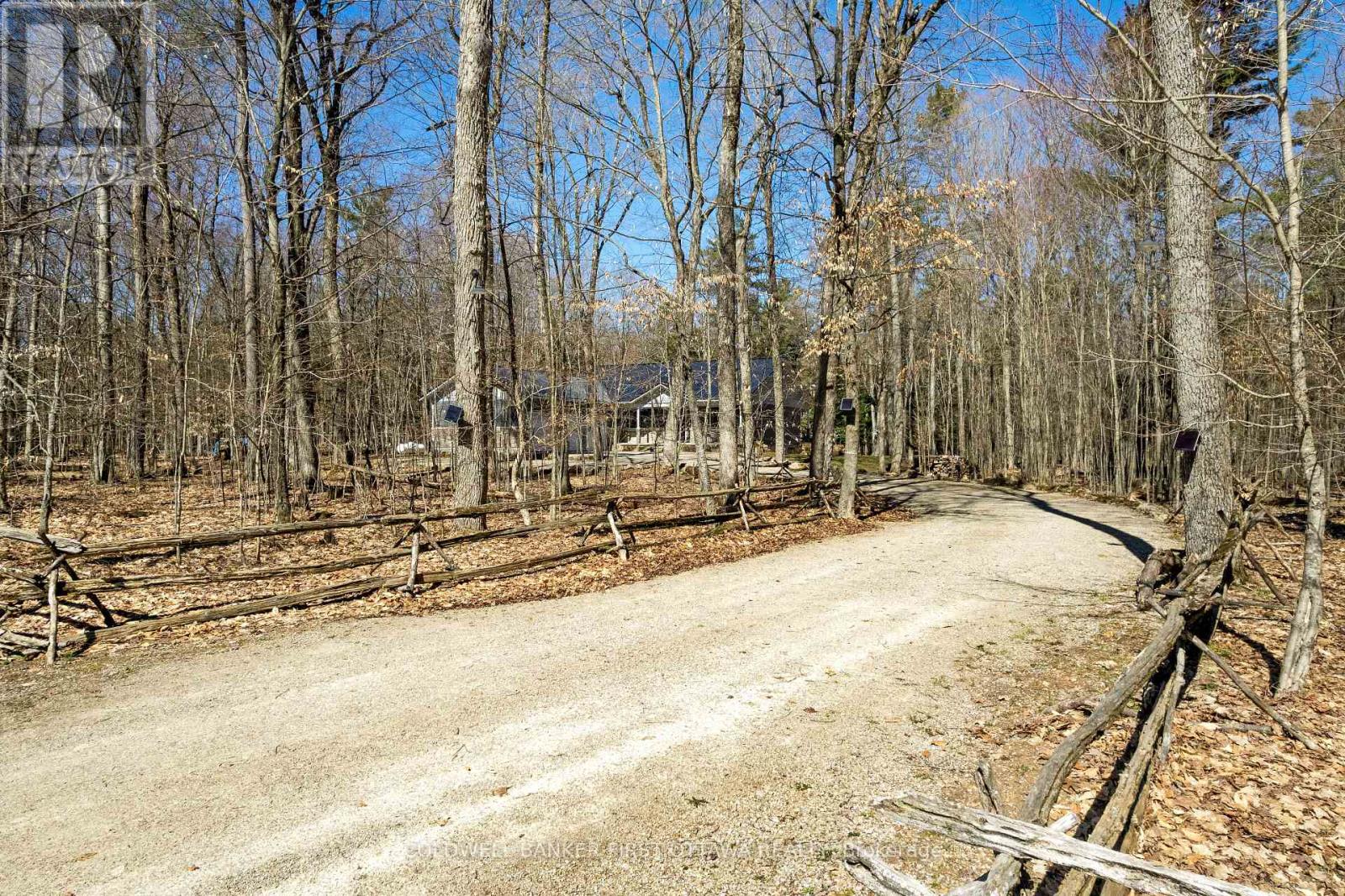Cedar rail fence all around home's 2 acres