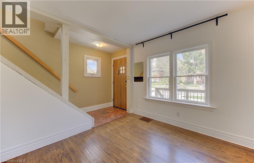 Hardwood flooring throughout the main area with a tiled entry