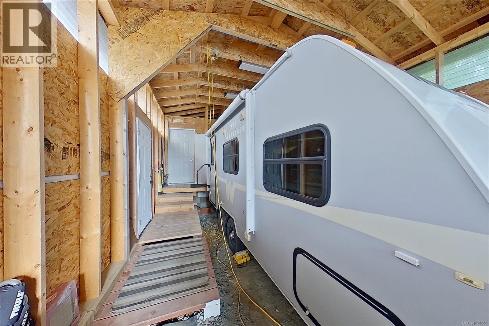 Covered RV Storage leading to workshop