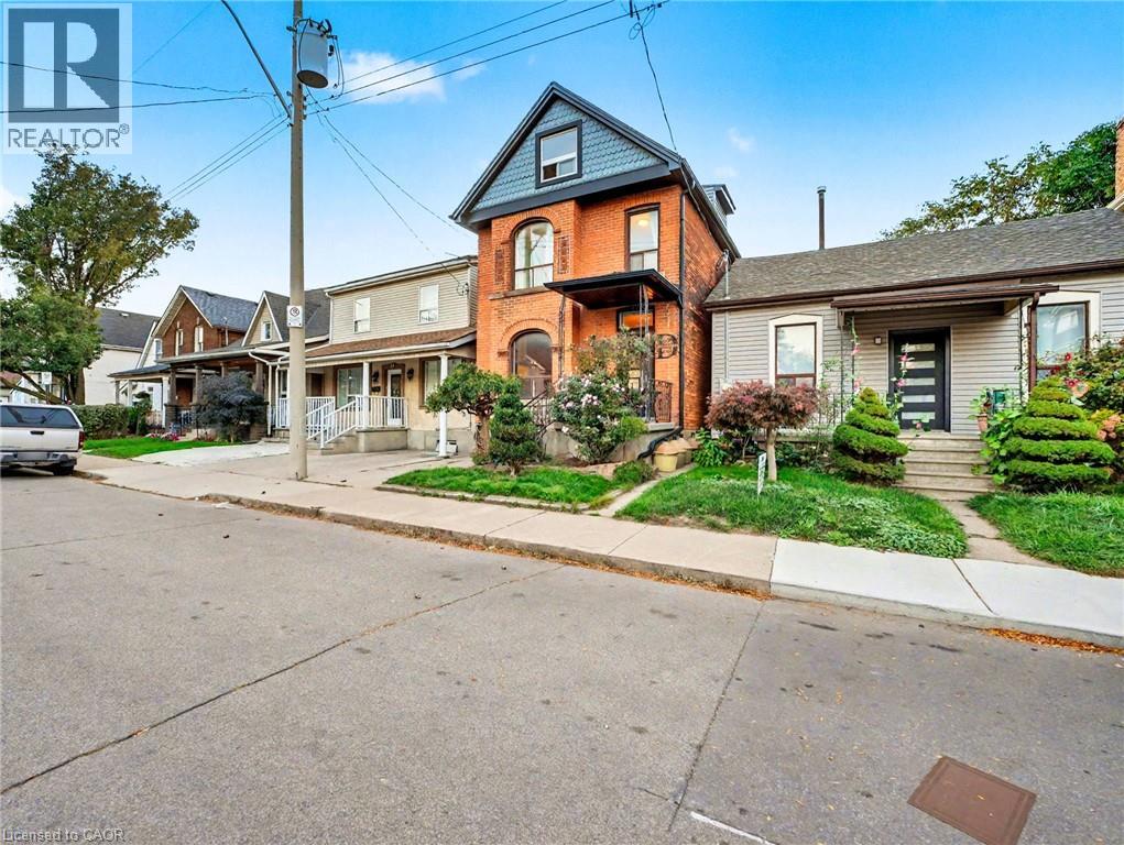 Victorian house with brick siding