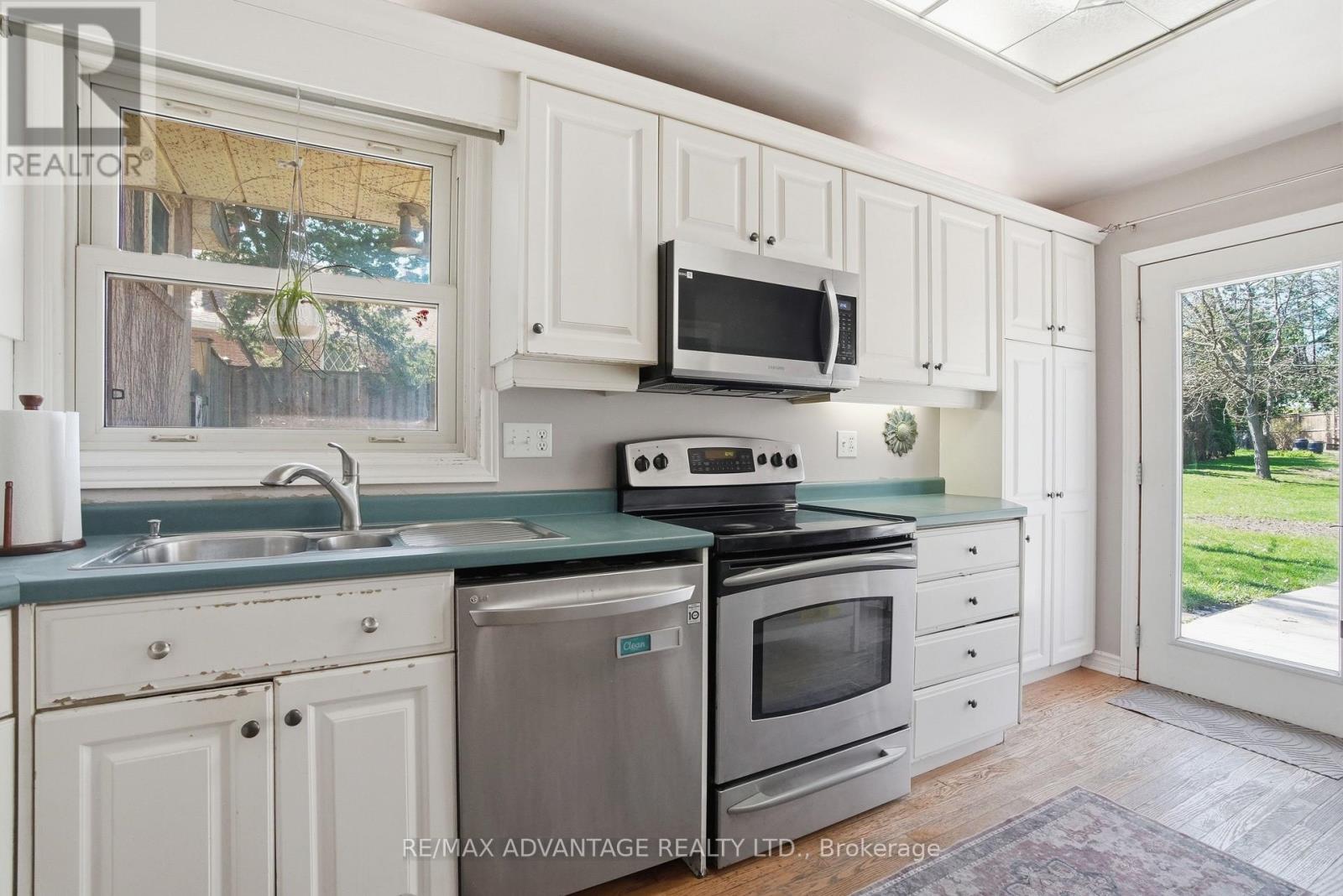 Bright kitchen to large deck and yard