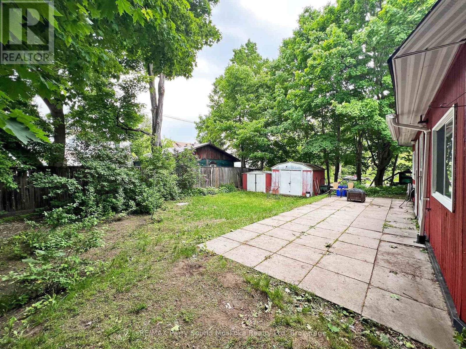Spacious level back yard with walkouts to patio