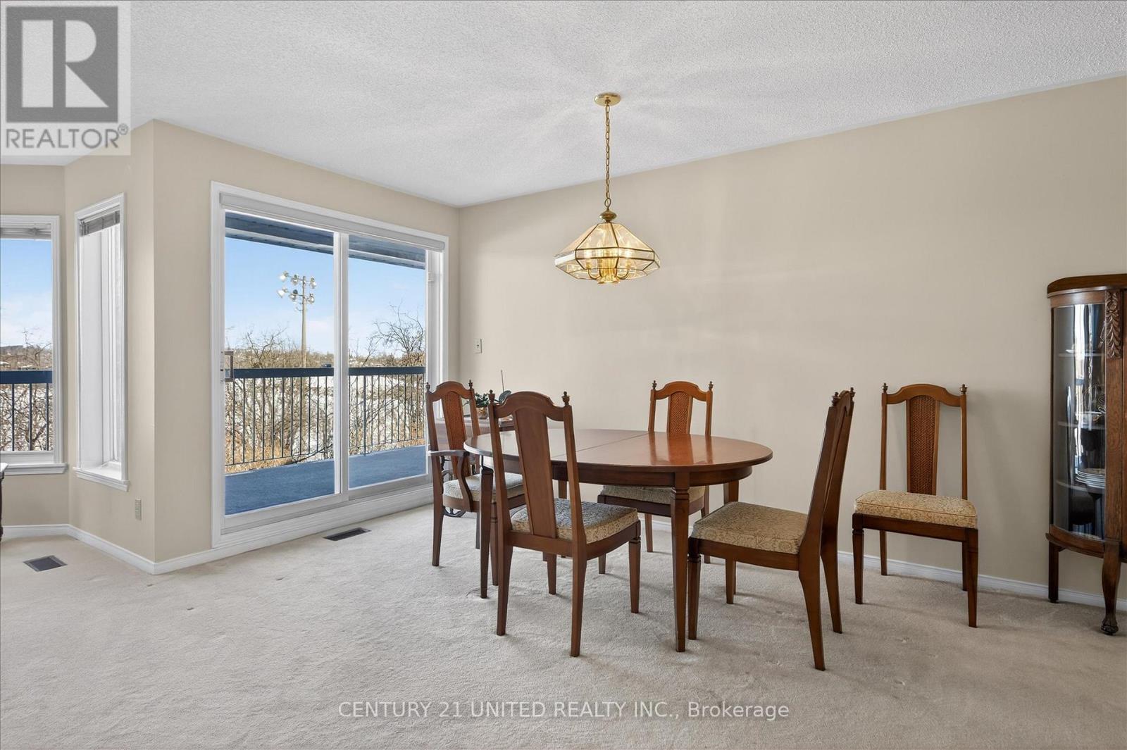 sun-filled living and dining room with walkout