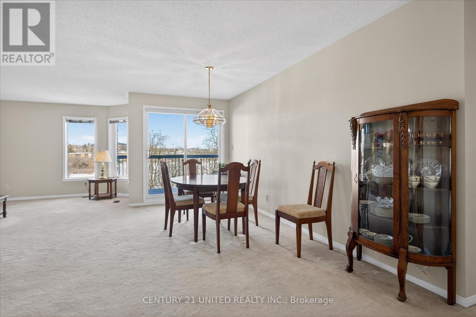 sun- filled dining room with walkout