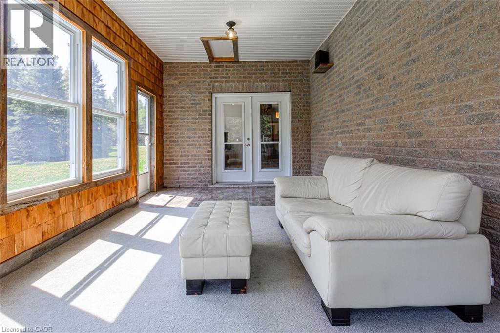 Sunroom featuring extensive window views