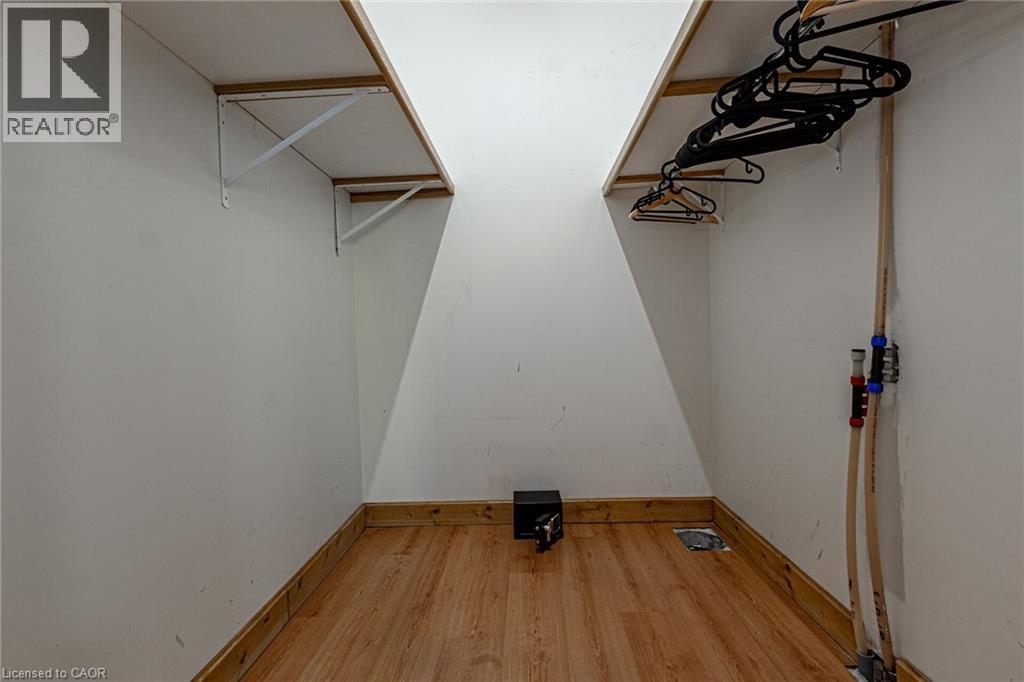 Wood-finish flooring throughout, complemented by white walls