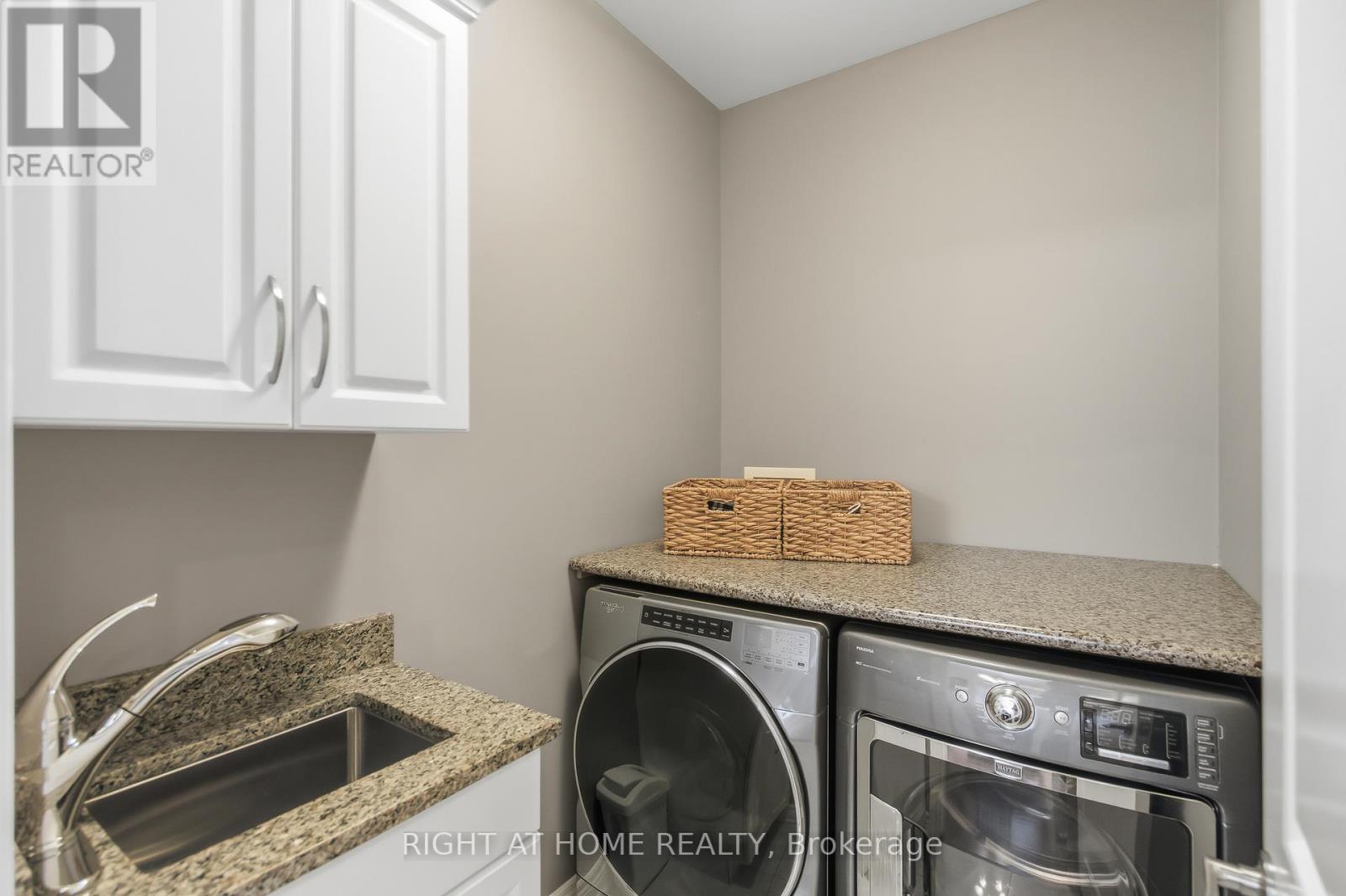 Convenient main floor laundry/ stone countertop