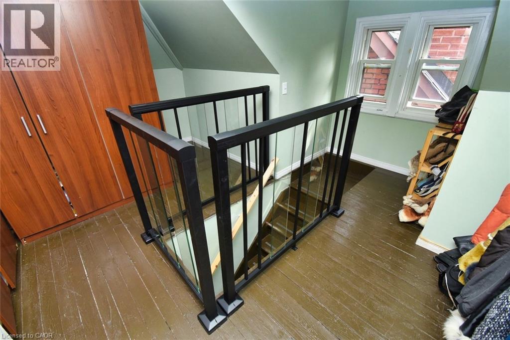 Stairwell with modern black railing and clear panels