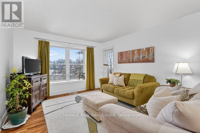 Living area with access to covered balcony