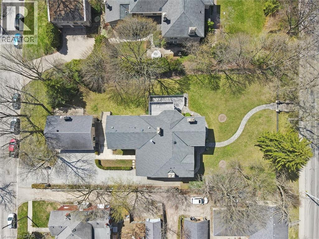 Expansive property featuring a main residence with a multi-gabled roofline and an additional detached structure