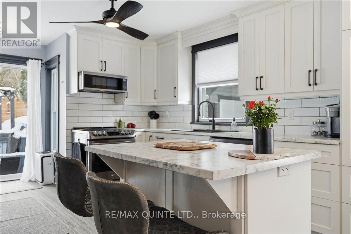 Beautiful updated kitchen and access to back deck