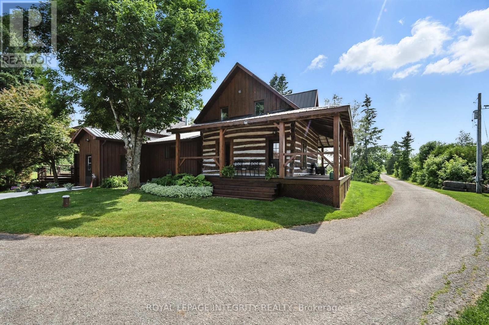 Log home with a wraparound porch