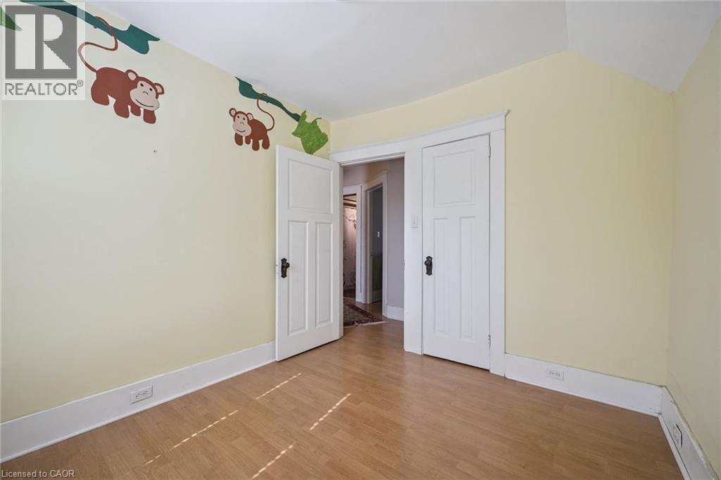 Light-toned wood-finish flooring with a subtle herringbone pattern